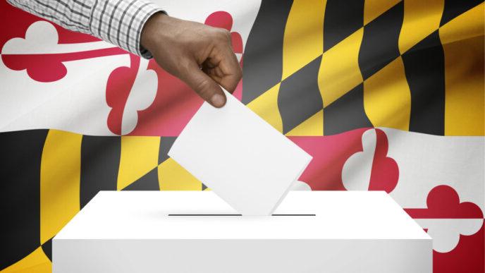 photo of ballot box with us state flag on background maryland flag